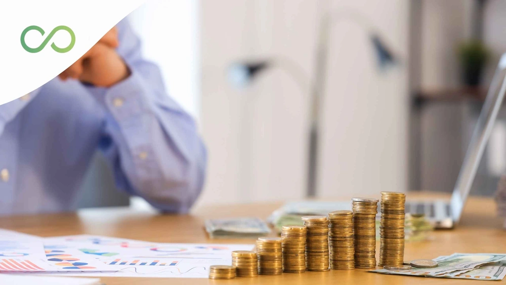 Stacks of coins, cash, and financial charts illustrating financial planning and economic growth Sustainable architecture firms Green Loop