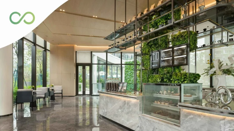 Modern coffee shop featuring vertical greenery, large windows, natural light, and contemporary sustainable design elements Sustainable Restaurant Design: 2026 Guide for Operators green loop