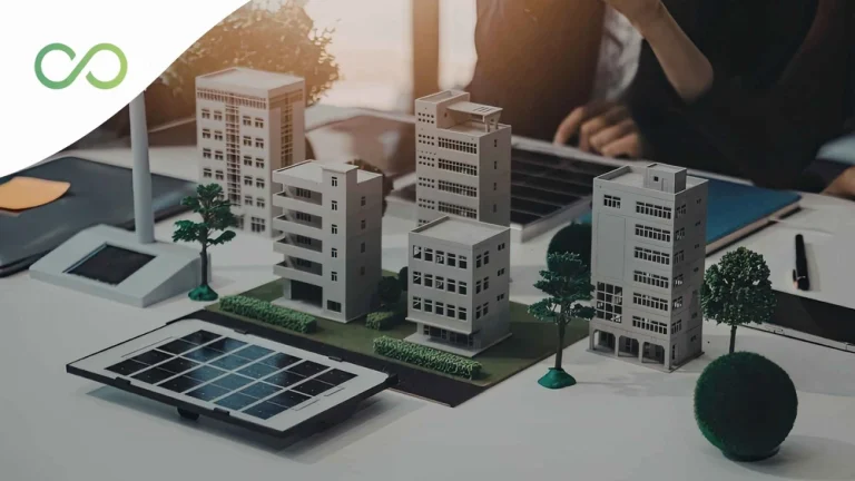 Person using a digital tablet next to a laptop in a workspace featuring technology and sustainability elements Energy modeling for buildings Green Loops